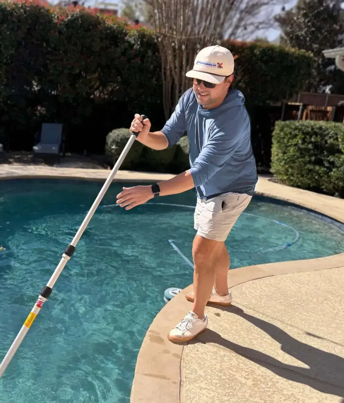 Poolside, TX technician servicing a residential pool in Dallas